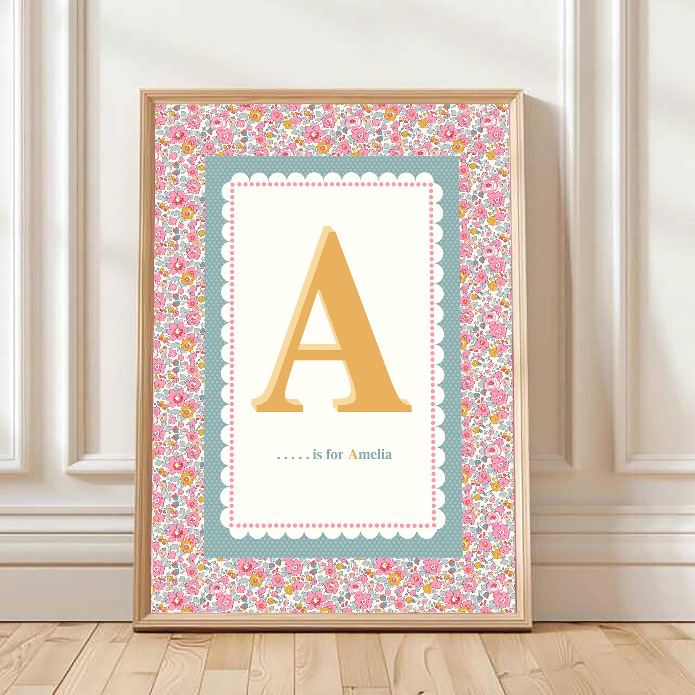 Personalised initial print in a gold frame with floral border
